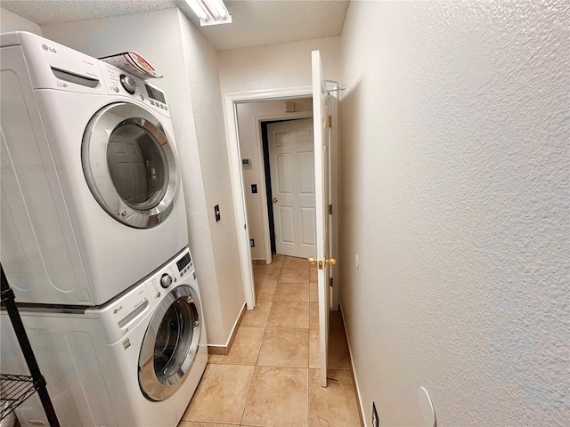 1307 Rain Forest Ln, Minneola, FL 34715 - laundry room featuring stacked washing machine and dryer, a textured ceiling, a textured wall, and light tile patterned flooring