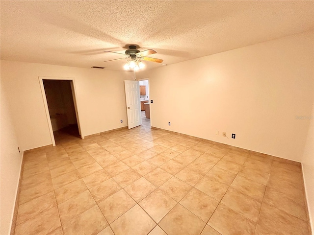 1307 Rain Forest Ln, Minneola, FL 34715 - unfurnished room featuring a ceiling fan, a textured ceiling, and light tile patterned flooring