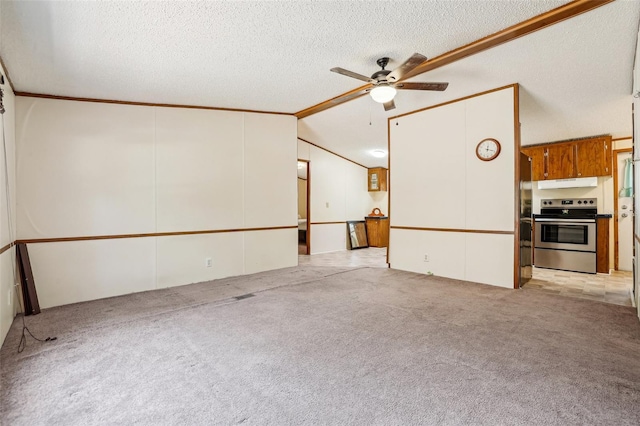 interior space featuring ceiling fan, light carpet, ornamental molding, and a textured ceiling