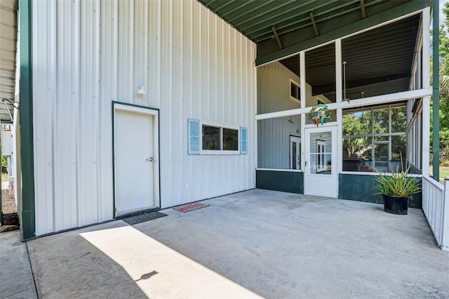 entrance to property with a patio