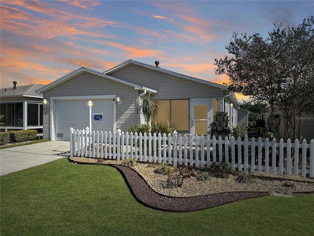 bungalow-style home featuring concrete driveway, fence private yard, and a garage