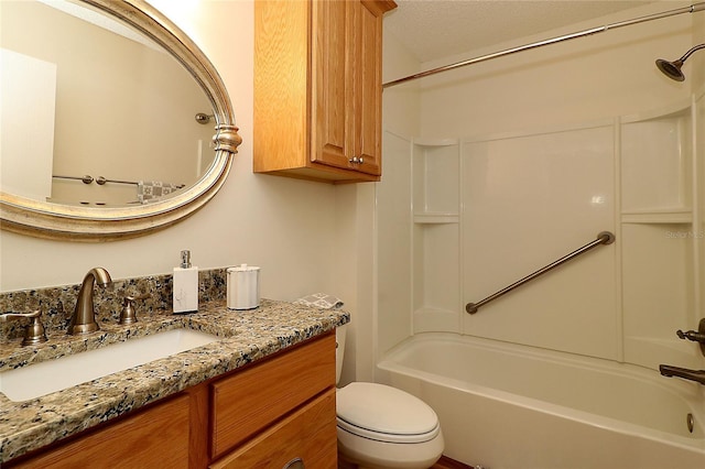 bathroom with vanity, bathing tub / shower combination, and toilet