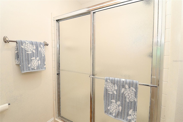 full bath with a shower with door