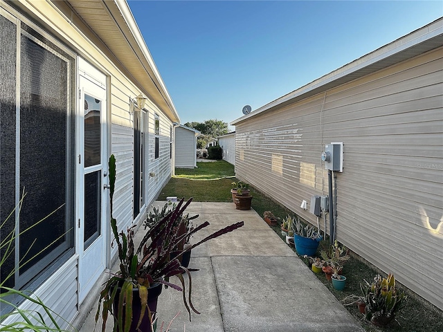 view of property exterior with a patio