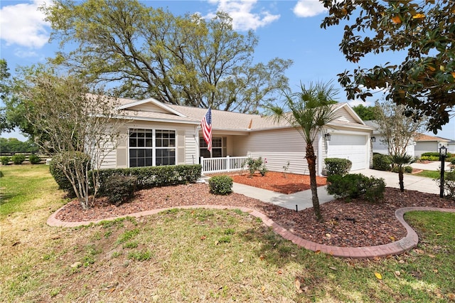 8097 SE 174th Belhaven Loop, The Villages, FL 32162 - ranch-style house featuring a garage, driveway, a front yard, covered porch, and a shingled roof