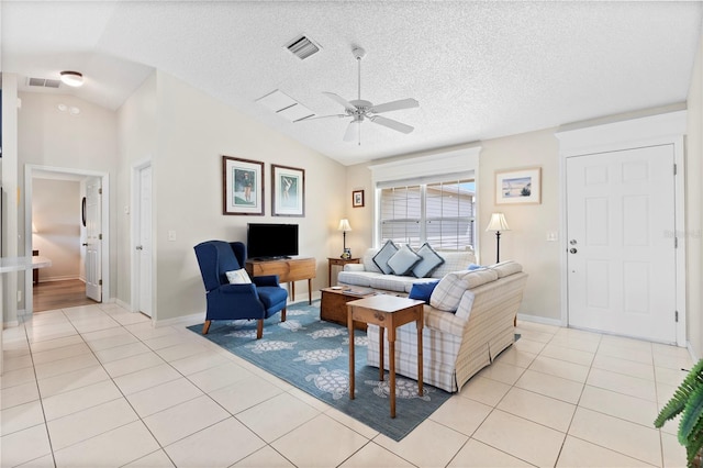 8097 SE 174th Belhaven Loop, The Villages, FL 32162 - living room with light tile patterned floors, a ceiling fan, lofted ceiling, baseboards, and a textured ceiling