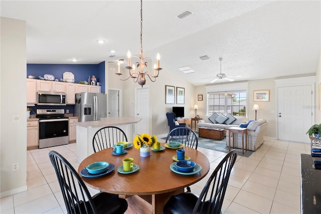8097 SE 174th Belhaven Loop, The Villages, FL 32162 - dining area featuring light tile patterned floors, ceiling fan, lofted ceiling, a chandelier, and baseboards