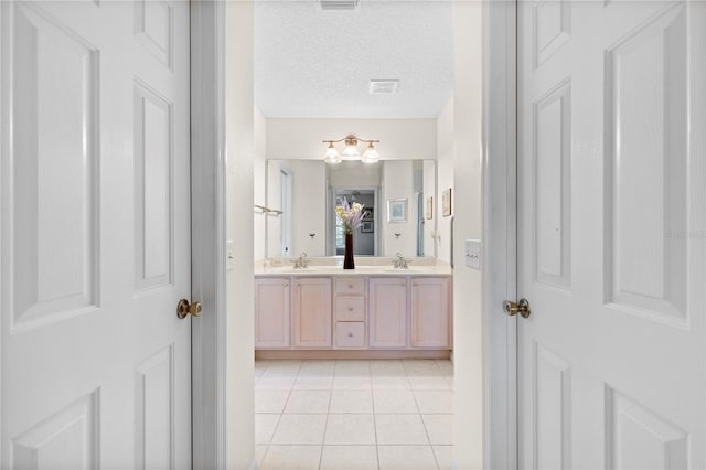 8097 SE 174th Belhaven Loop, The Villages, FL 32162 - full bath with double vanity, tile patterned flooring, and a textured ceiling