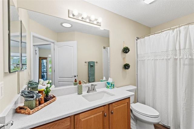 2139 Kaylee Dr, The Villages, FL 32162 - full bath with a textured ceiling, toilet, and vanity