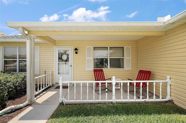 518 Alcazar Ct, The Villages, FL 32159 - doorway to property with a porch