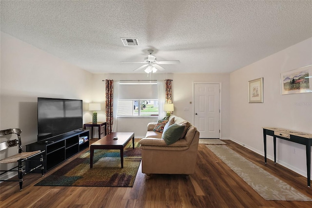 518 Alcazar Ct, The Villages, FL 32159 - living area featuring a textured ceiling, visible vents, ceiling fan, baseboards, and wood finished floors