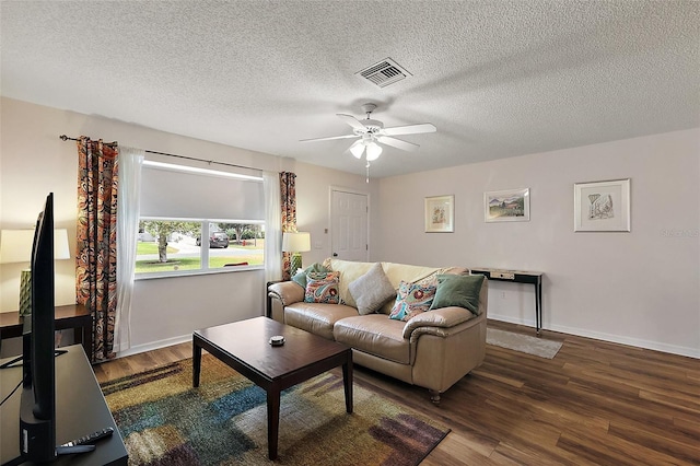 518 Alcazar Ct, The Villages, FL 32159 - living room featuring visible vents, wood finished floors, ceiling fan, and a textured ceiling