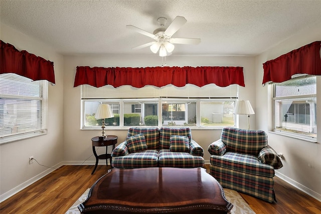 518 Alcazar Ct, The Villages, FL 32159 - sitting room with wood finished floors, a textured ceiling, and plenty of natural light