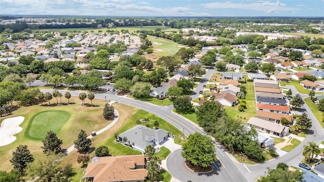 drone / aerial view featuring a residential view and golf course view