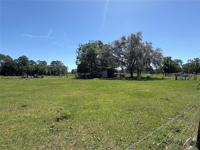 view of yard with a rural view