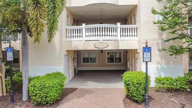 1356 Centre Court Ridge Dr Unit 103, Reunion, FL 34747 - doorway to property with stucco siding and a balcony