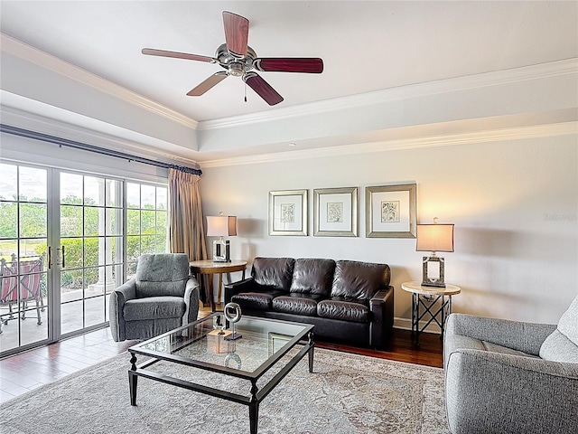 1356 Centre Court Ridge Dr Unit 103, Reunion, FL 34747 - living area with a ceiling fan, a tray ceiling, ornamental molding, and wood-type flooring
