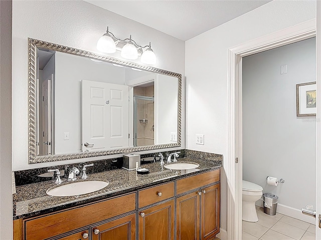 1356 Centre Court Ridge Dr Unit 103, Reunion, FL 34747 - bathroom with tile patterned floors, a sink, double vanity, and toilet