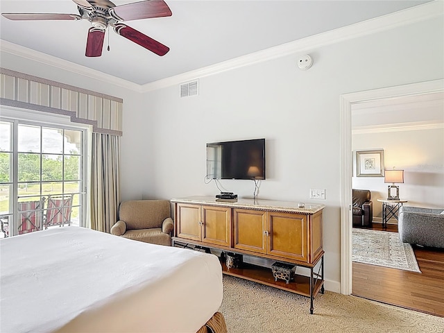 1356 Centre Court Ridge Dr Unit 103, Reunion, FL 34747 - bedroom featuring ceiling fan, access to outside, light wood-style flooring, ornamental molding, and visible vents