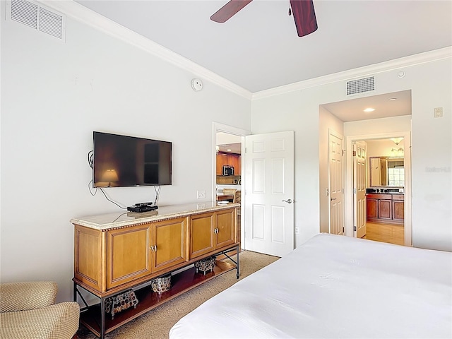 1356 Centre Court Ridge Dr Unit 103, Reunion, FL 34747 - bedroom featuring connected bathroom, ornamental molding, and visible vents