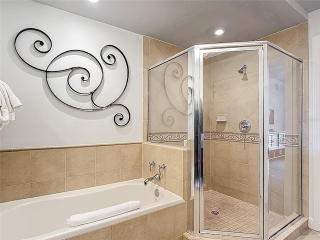1356 Centre Court Ridge Dr Unit 103, Reunion, FL 34747 - bathroom with a garden tub, recessed lighting, and a stall shower
