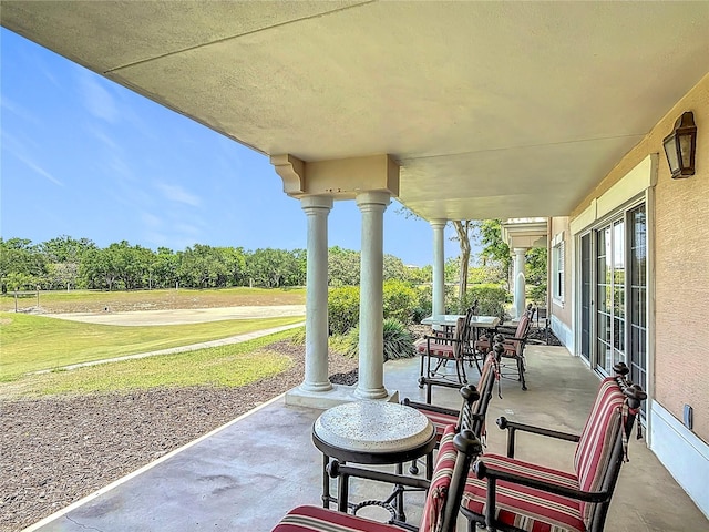 1356 Centre Court Ridge Dr Unit 103, Reunion, FL 34747 - view of patio / terrace featuring view of golf course and covered porch