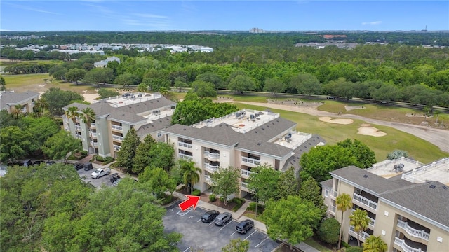1356 Centre Court Ridge Dr Unit 103, Reunion, FL 34747 - drone / aerial view featuring a wooded view