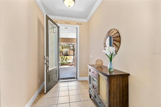 foyer with light tile patterned flooring, crown molding, and baseboards