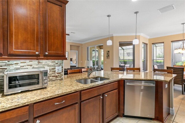kitchen with hanging light fixtures, a sink, dishwasher, a toaster, and visible vents