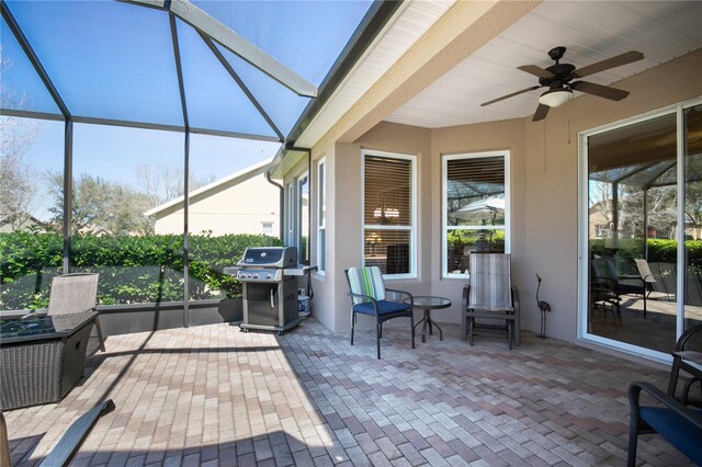 sunroom / solarium with ceiling fan