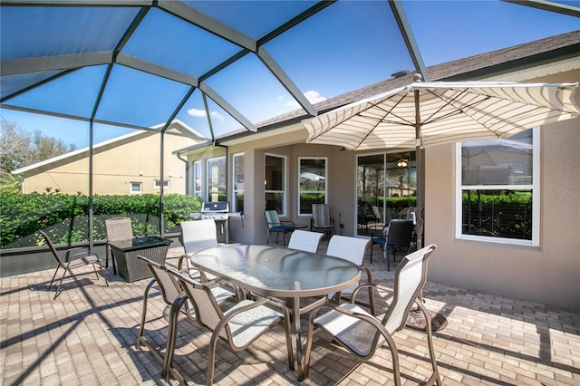 view of patio / terrace with a lanai and outdoor dining space