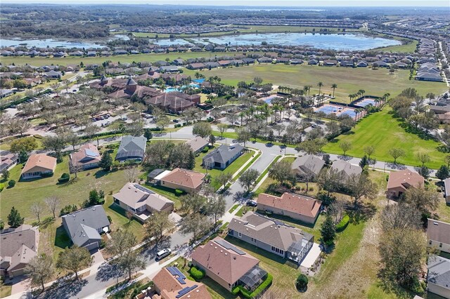 bird's eye view with a water view and a residential view