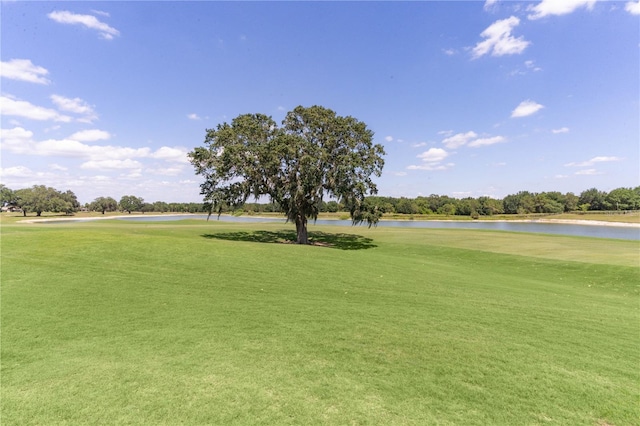 1721 Sunset Ridge Dr, The Villages, FL 32162 - surrounding community with view of golf course, a water view, and a yard