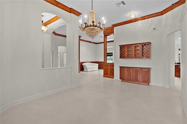 1721 Sunset Ridge Dr, The Villages, FL 32162 - unfurnished living room with arched walkways, a chandelier, light tile patterned floors, baseboards, and crown molding