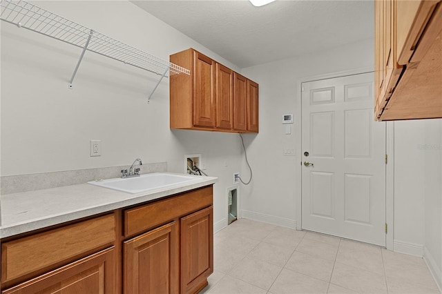 1721 Sunset Ridge Dr, The Villages, FL 32162 - washroom with hookup for a washing machine, cabinet space, light tile patterned flooring, and baseboards
