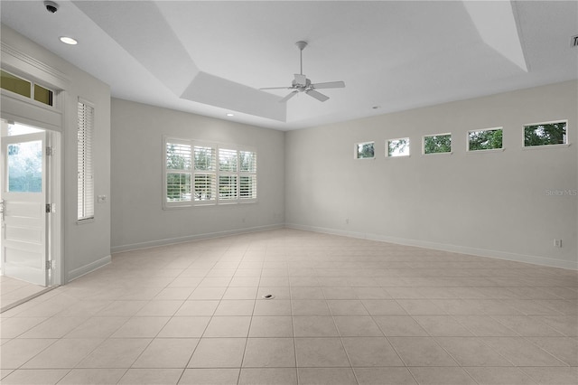 1721 Sunset Ridge Dr, The Villages, FL 32162 - spare room featuring a raised ceiling, a ceiling fan, light tile patterned floors, recessed lighting, and baseboards