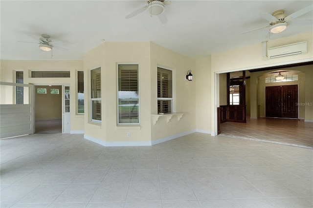 1721 Sunset Ridge Dr, The Villages, FL 32162 - spare room featuring a wall mounted air conditioner, ceiling fan, light tile patterned floors, and baseboards