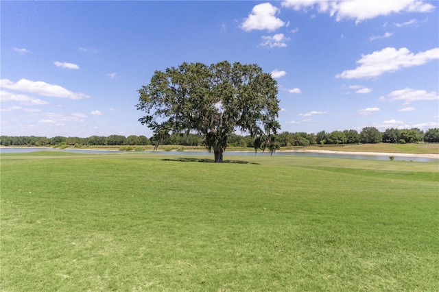 1721 Sunset Ridge Dr, The Villages, FL 32162 - view of home's community with a water view, a lawn, and golf course view