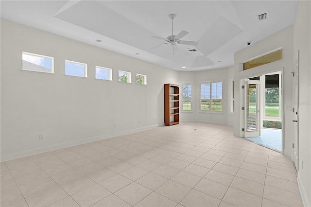 1721 Sunset Ridge Dr, The Villages, FL 32162 - unfurnished room featuring a ceiling fan, a tray ceiling, light tile patterned floors, baseboards, and recessed lighting