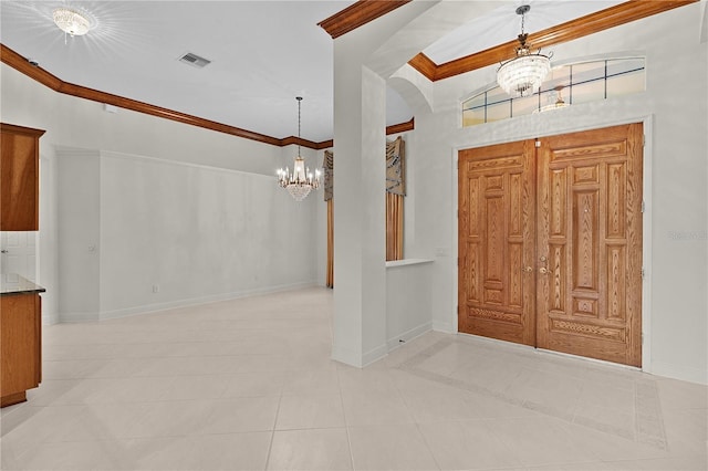 1721 Sunset Ridge Dr, The Villages, FL 32162 - tiled entrance foyer featuring a chandelier, ornamental molding, baseboards, and arched walkways