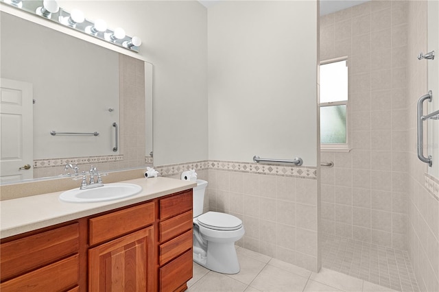 1721 Sunset Ridge Dr, The Villages, FL 32162 - bathroom featuring walk in shower, vanity, toilet, tile patterned floors, and tile walls