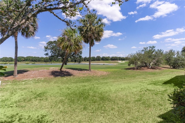 1721 Sunset Ridge Dr, The Villages, FL 32162 - view of green lawn with a water view and view of golf course