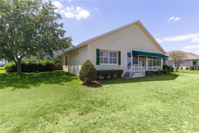 1721 Sunset Ridge Dr, The Villages, FL 32162 - back of property featuring stucco siding and a lawn