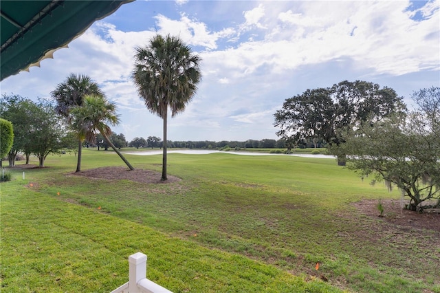 1721 Sunset Ridge Dr, The Villages, FL 32162 - view of grassy yard featuring view of golf course and a water view
