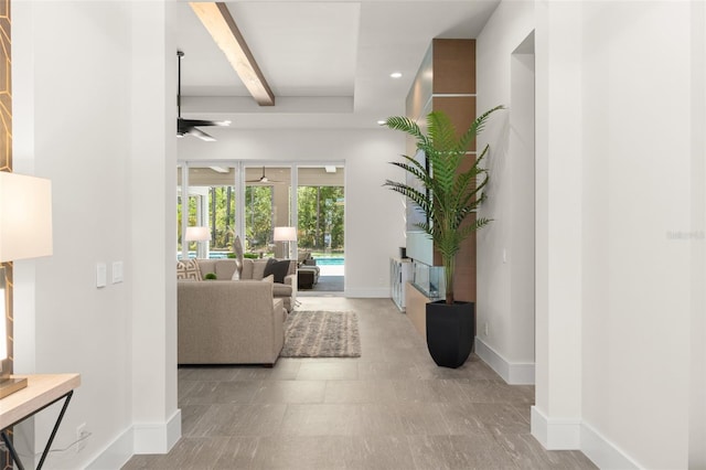 hallway with beam ceiling, baseboards, and recessed lighting