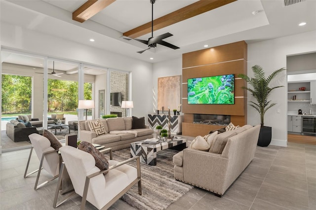 living area featuring beamed ceiling, wine cooler, a ceiling fan, and recessed lighting
