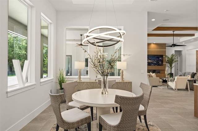 dining room featuring recessed lighting, ceiling fan with notable chandelier, and baseboards