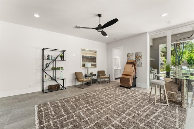 living area featuring baseboards, recessed lighting, tile patterned floors, and ceiling fan
