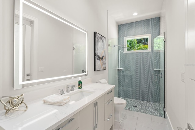 full bathroom featuring tile patterned floors, toilet, vanity, and a stall shower