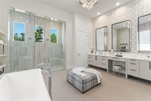 bathroom with tile patterned floors, a healthy amount of sunlight, a notable chandelier, and a stall shower